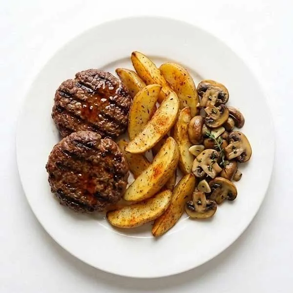 Grilled Beef Patties with Potato Wedges & Sautéed Mushrooms
